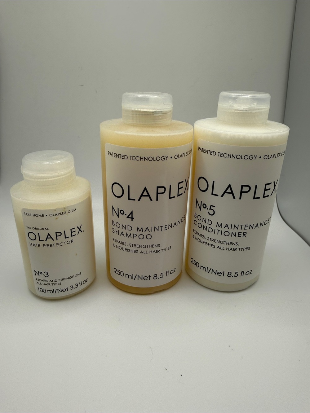 New OLAPLEX No.3, No.4 & No.5 Hair Trio - Cream & White
